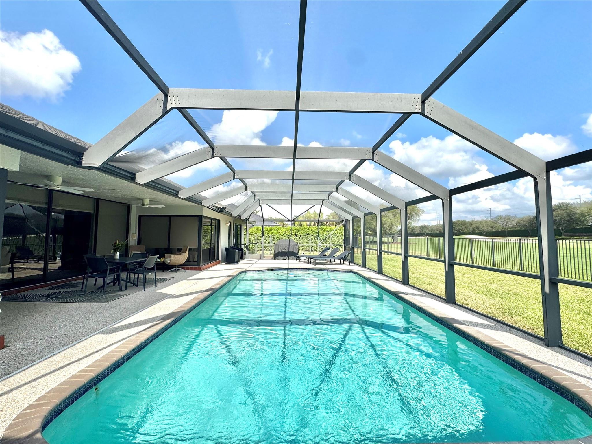 11392 Boca Woods Lane Boca Raton, FL 33428 - Photo 8 of 26 a view of swimming pool with a porch