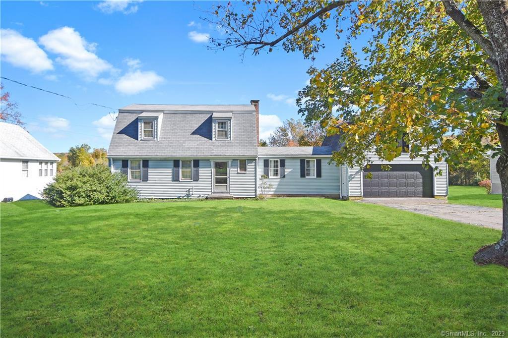 606 Millbrook Road Middletown, CT 06457 - Photo 1 of 1 a front view of a house with a garden