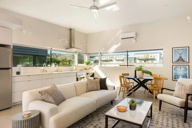 a view of a kitchen from a hallway