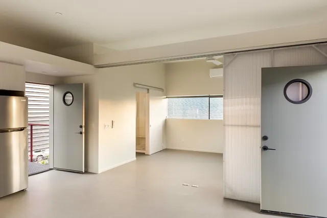 a bathroom with a shower sink and mirror