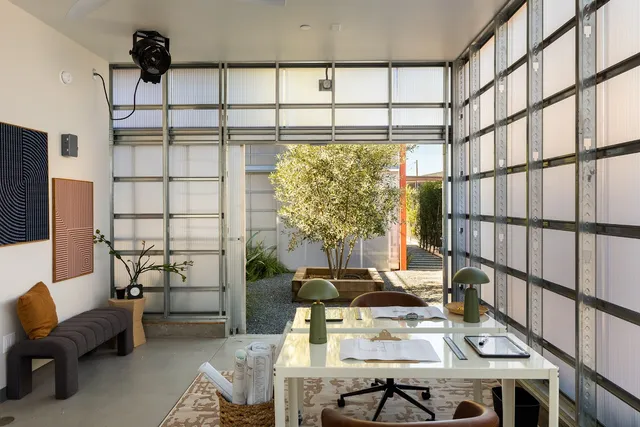 a workspace with furniture and a window