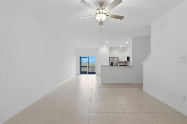 a view of a kitchen with a sink and cabinet