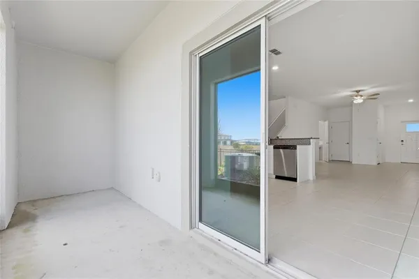 a view of a big yard with potted plants