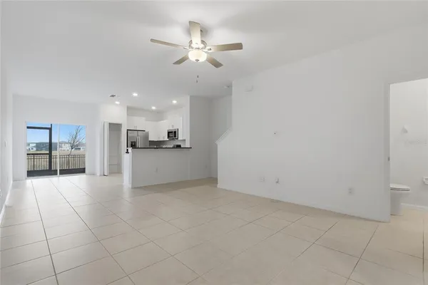 a view of a kitchen with a sink and a window