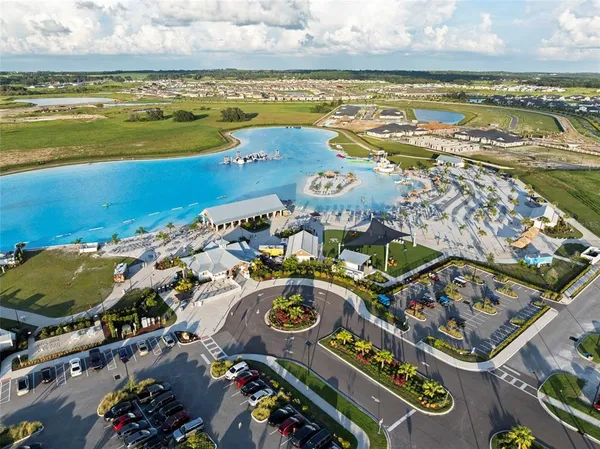 a view of a lake with a house in the background