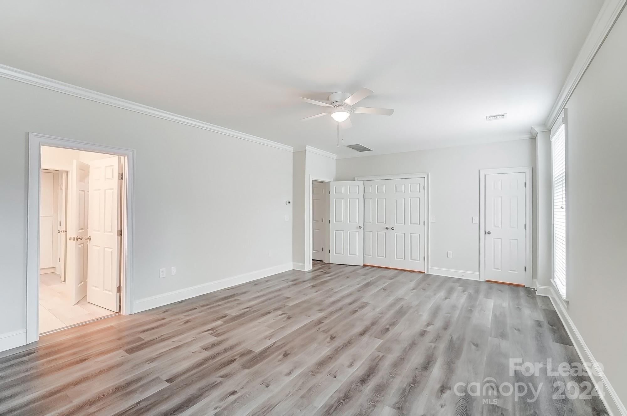 1301 Queens Road, Unit 205 Charlotte, NC 28207 - Photo 17 of 23 a view of empty room with wooden floor
