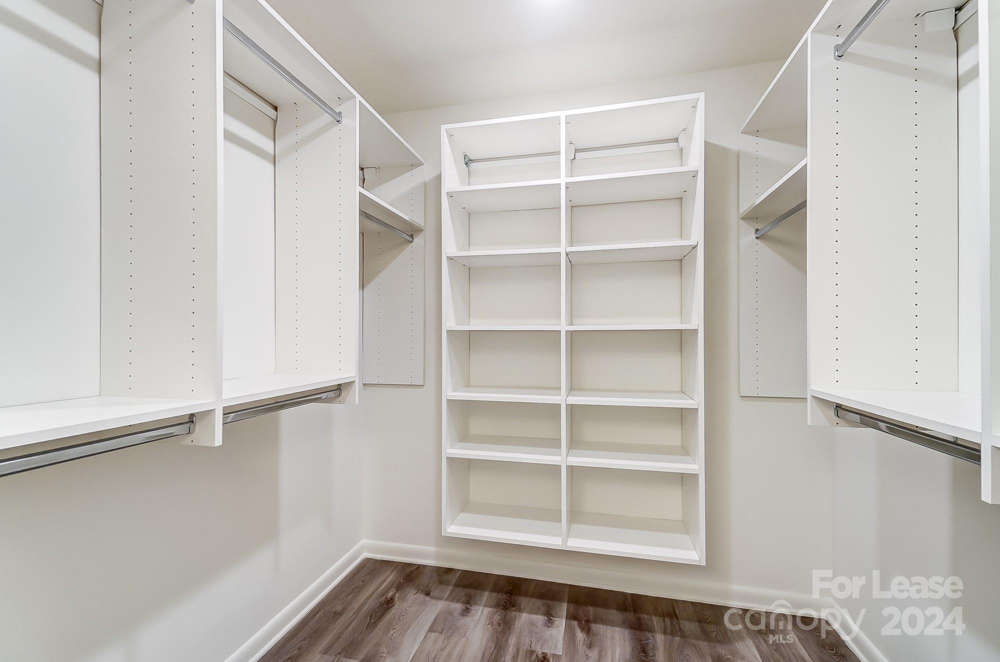 1301 Queens Road, Unit 205 Charlotte, NC 28207 - Photo 22 of 23 a view of walk in closet with empty racks