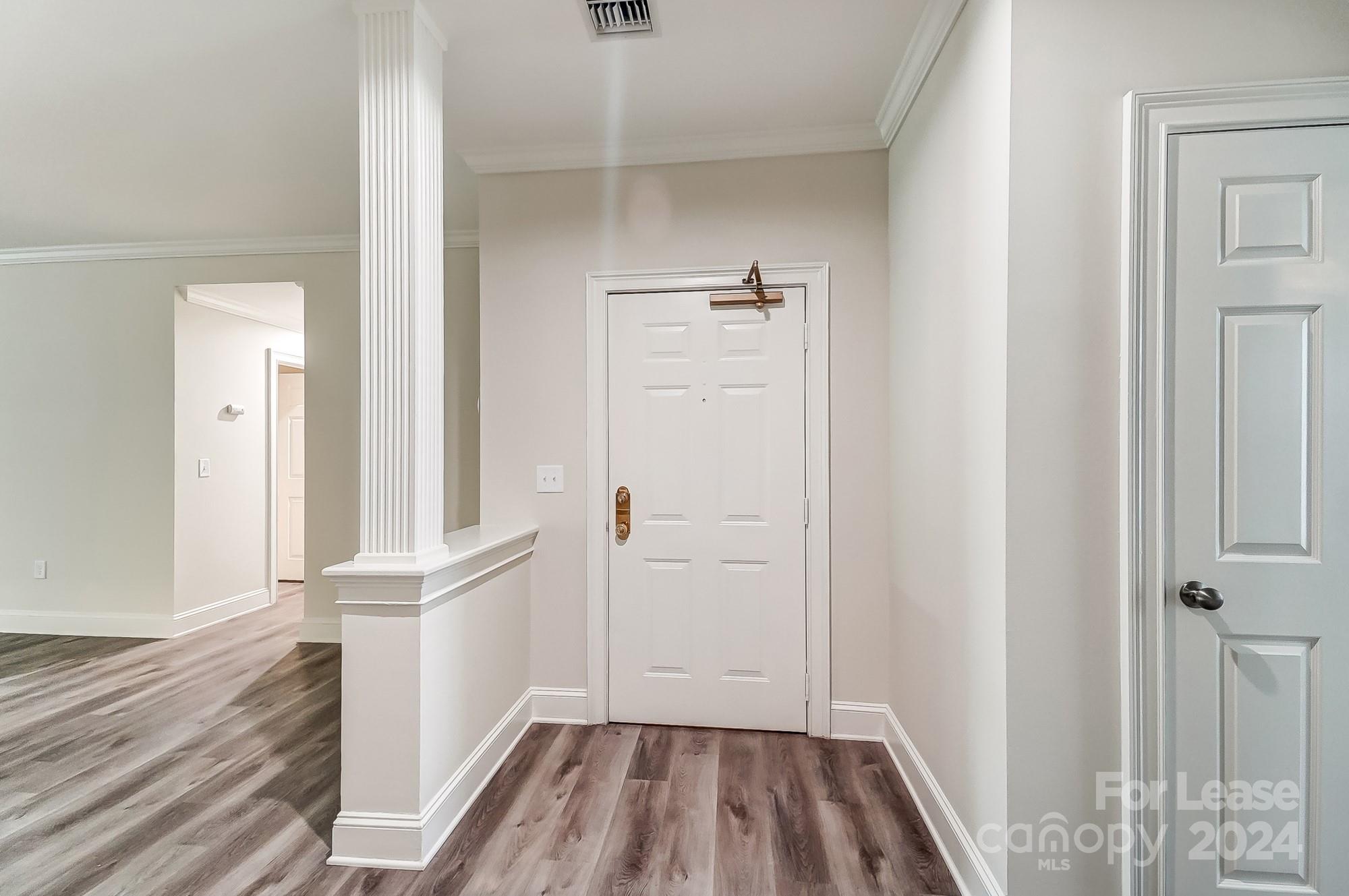 1301 Queens Road, Unit 205 Charlotte, NC 28207 - Photo 7 of 23 wooden floor in an empty room