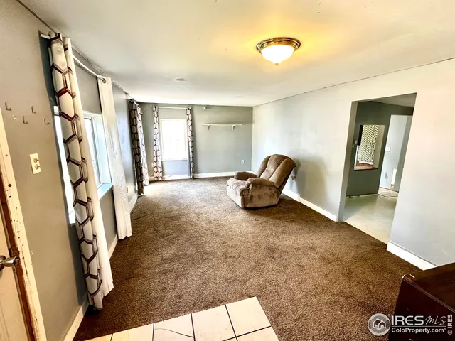 a view of room with window and hallway