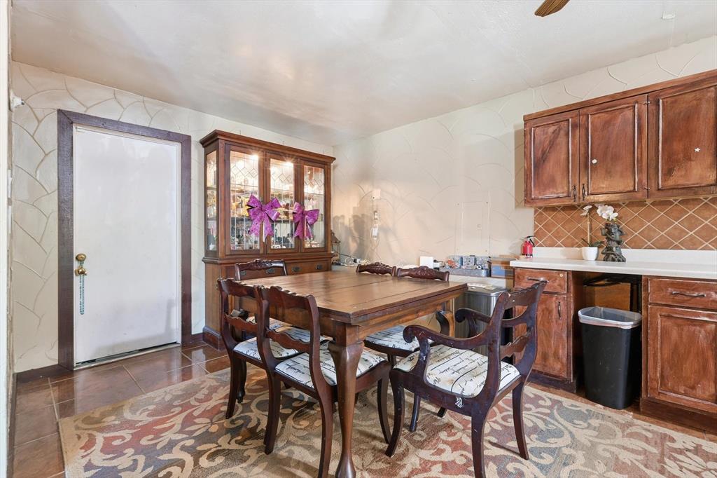 6317 Locust Street Rowlett, TX 75089 - Photo 12 of 40 a view of a dining room with furniture
