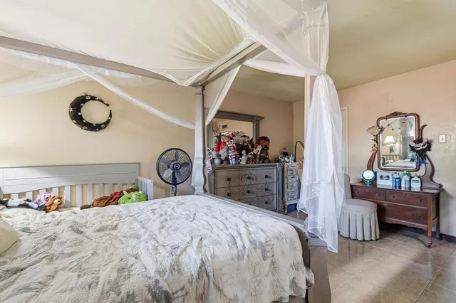 a bed room with a bed and a mirror