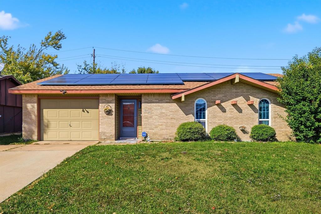 6317 Locust Street Rowlett, TX 75089 - Photo 2 of 40 a front view of a house with a yard