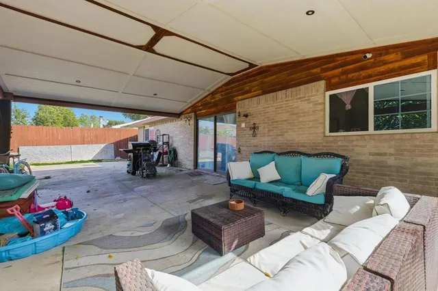 a outdoor living space with furniture and a potted plant