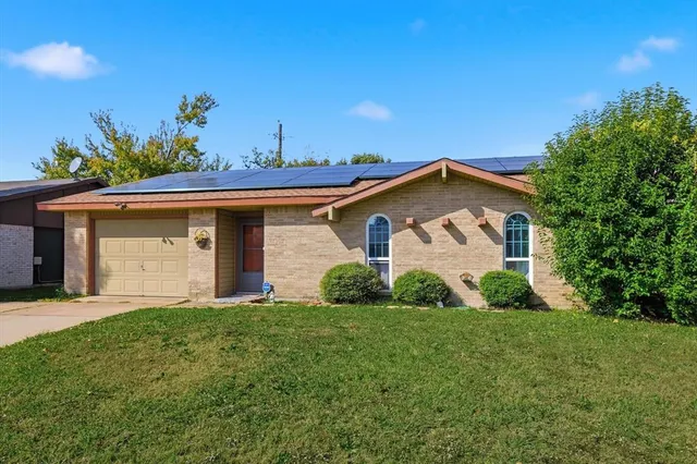 a view of a house with garden and yard