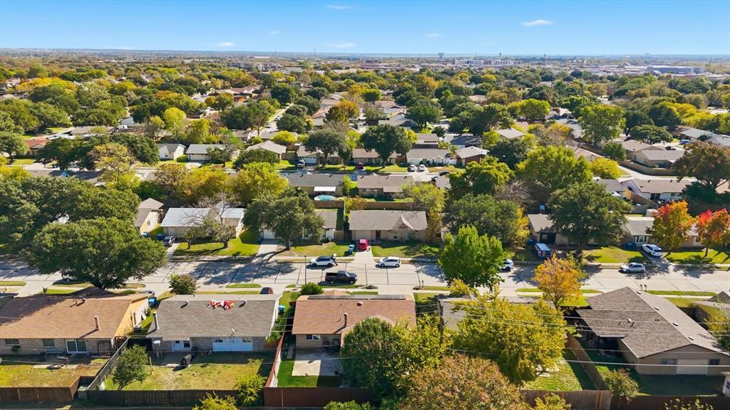 6317 Locust Street Rowlett, TX 75089 - Photo 39 of 40 an aerial view of a city with lots of residential buildings and ocean view in back