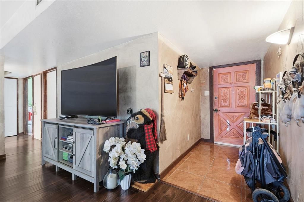 6317 Locust Street Rowlett, TX 75089 - Photo 5 of 40 a living room with furniture and a flat screen tv