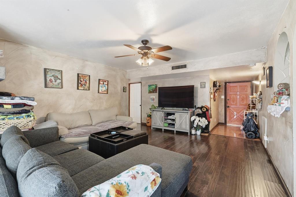 6317 Locust Street Rowlett, TX 75089 - Photo 10 of 40 a living room with furniture and a flat screen tv