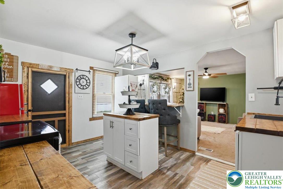 40 Apache Lehighton, PA 18235 - Photo 13 of 32 a view of a kitchen with kitchen island a counter top space appliances and a ceiling fan