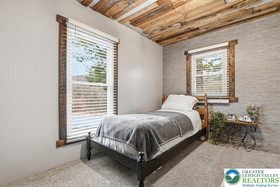 40 Apache Lehighton, PA 18235 - Photo 20 of 32 a bed sitting in a bedroom next to a window