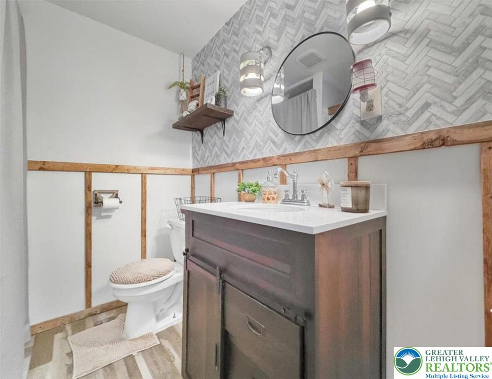 40 Apache Lehighton, PA 18235 - Photo 22 of 32 a bathroom with a sink a toilet and a mirror