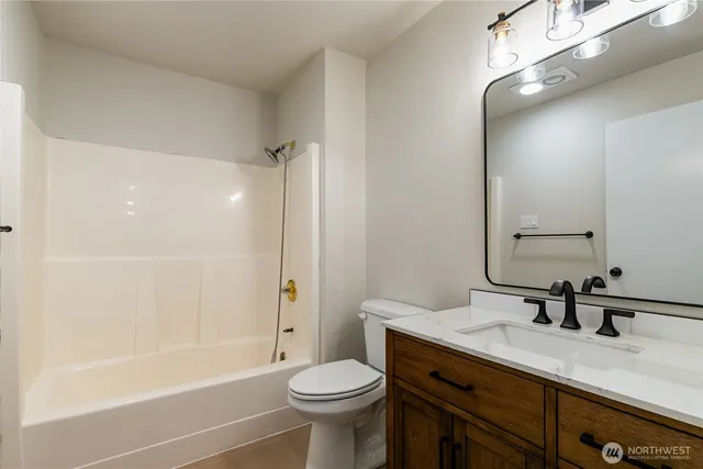 a bathroom with a sink a toilet and a bathtub