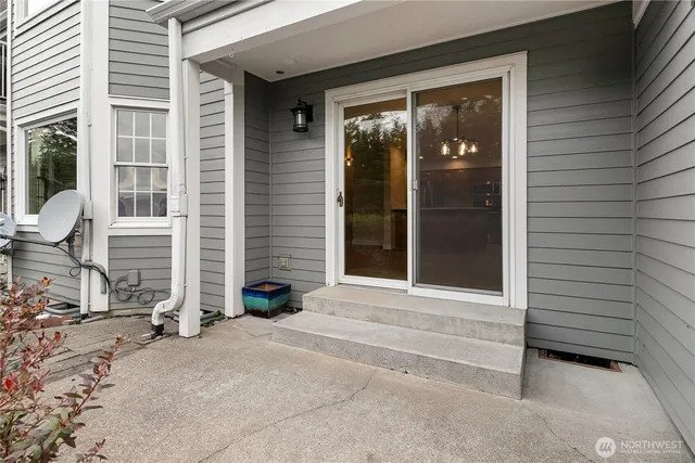 a view of house with brick walls