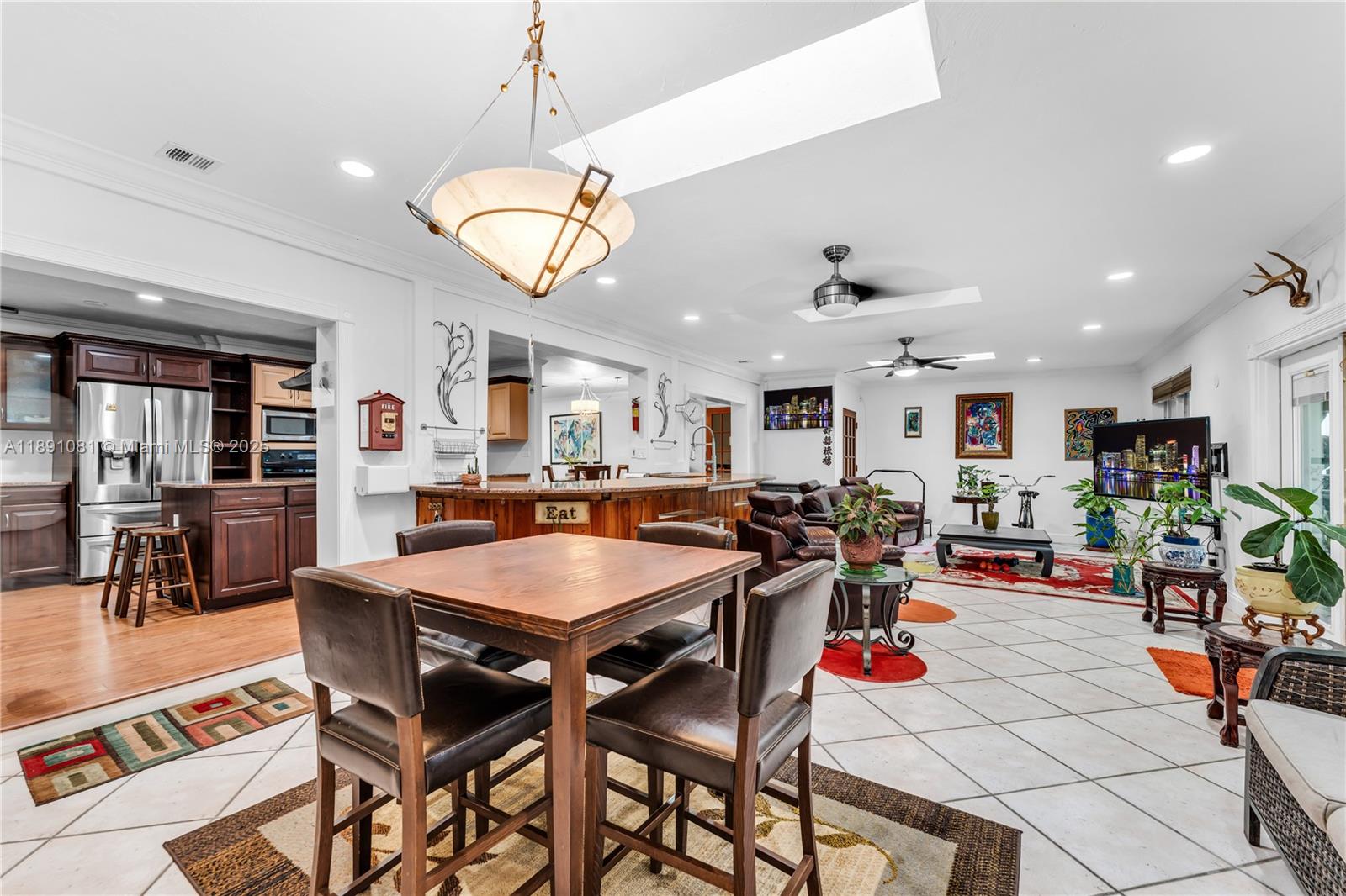 9081 Southwest 140th Street Miami, FL 33176 - Photo 11 of 29 a room with lots of tables a dining table and chairs