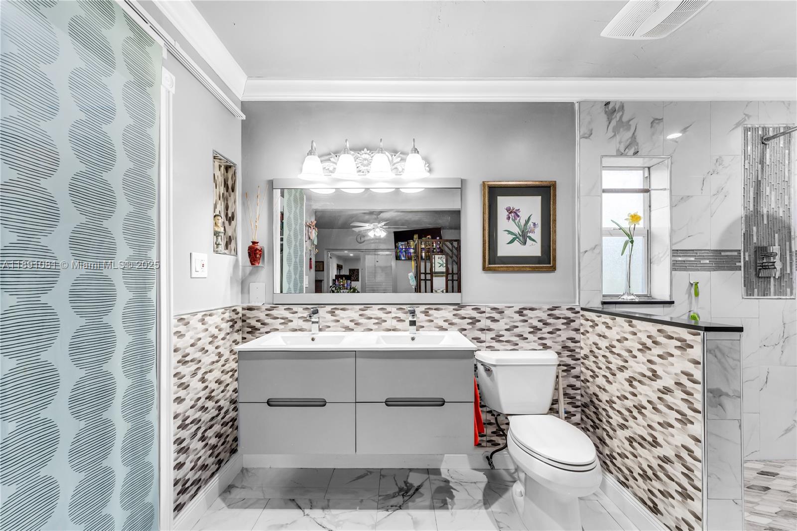 9081 Southwest 140th Street Miami, FL 33176 - Photo 24 of 29 a bathroom with a sink toilet mirror and shower