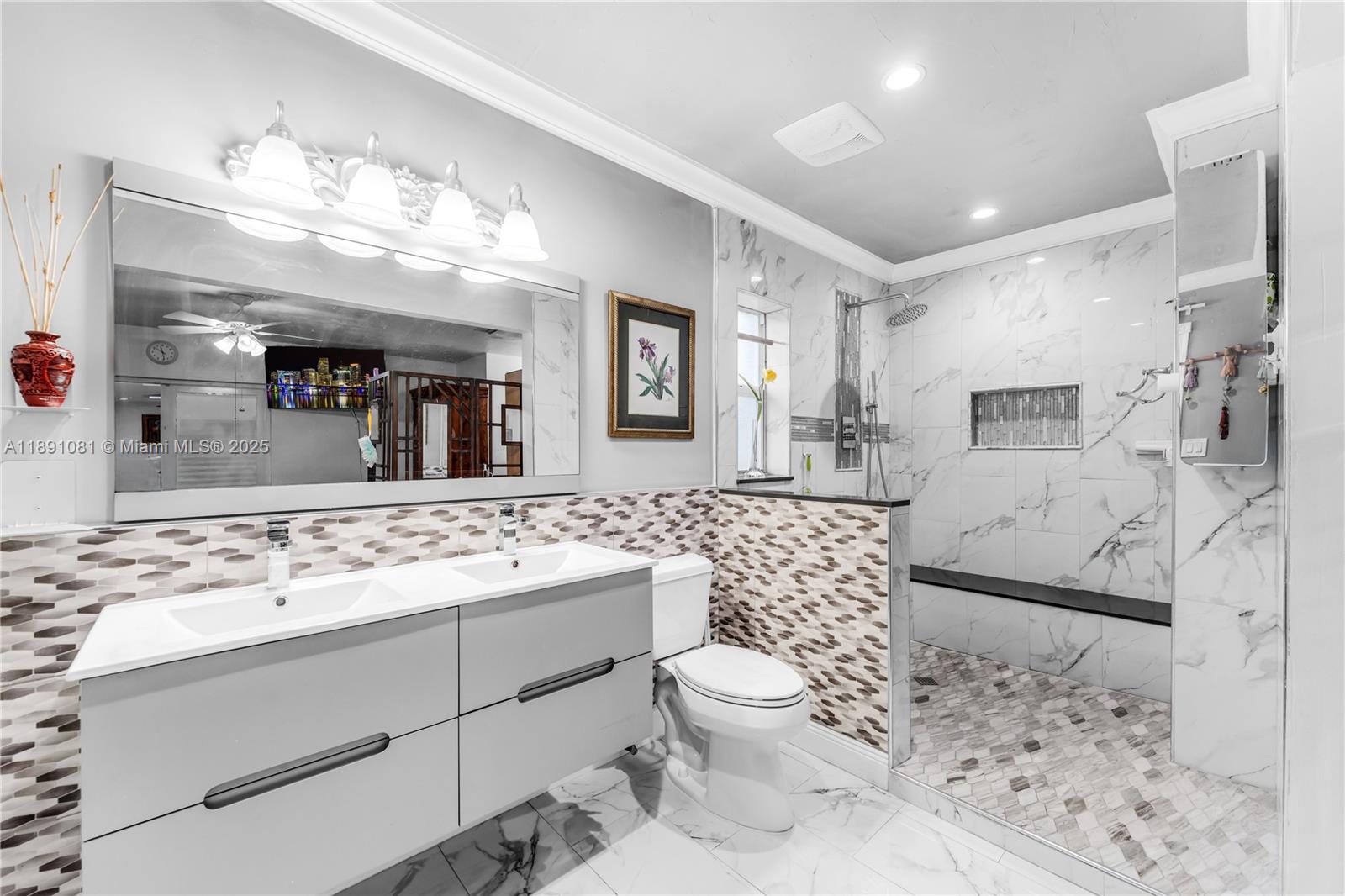 9081 Southwest 140th Street Miami, FL 33176 - Photo 25 of 29 a bathroom with a sink a toilet and shower