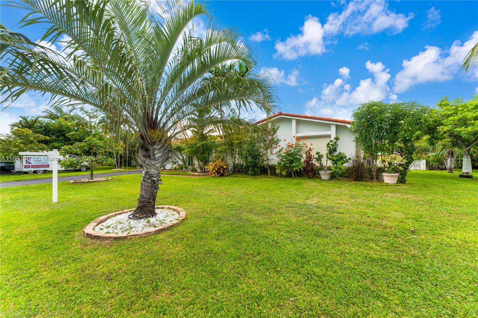 9081 Southwest 140th Street Miami, FL 33176 - Photo 3 of 29 a view of a playground with a tree