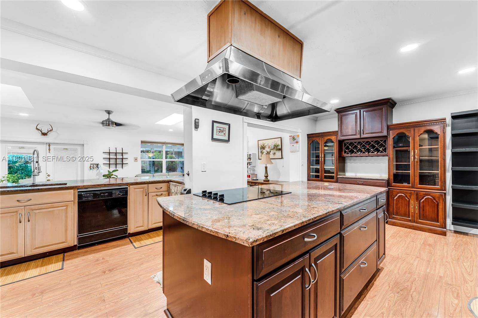 9081 Southwest 140th Street Miami, FL 33176 - Photo 7 of 29 a kitchen with a stove and a kitchen island