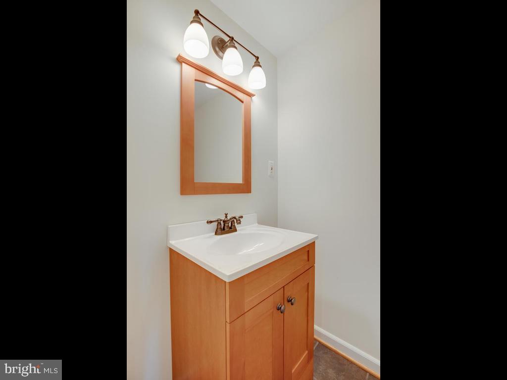2102 Cross Trails Road Baltimore, MD 21244 - Photo 29 of 39 Updated lights, mirror, vanity and toilet