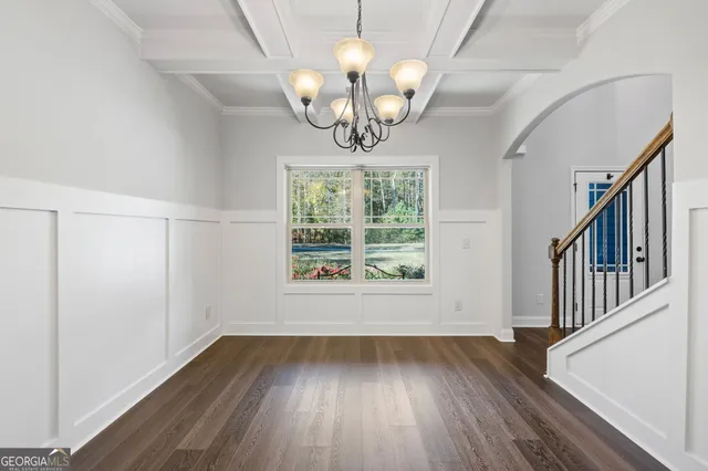 a bathroom with a granite countertop toilet a sink and a mirror