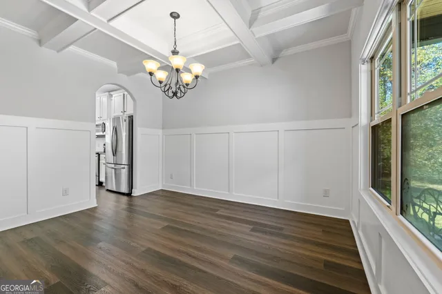 a view of entryway with wooden floor