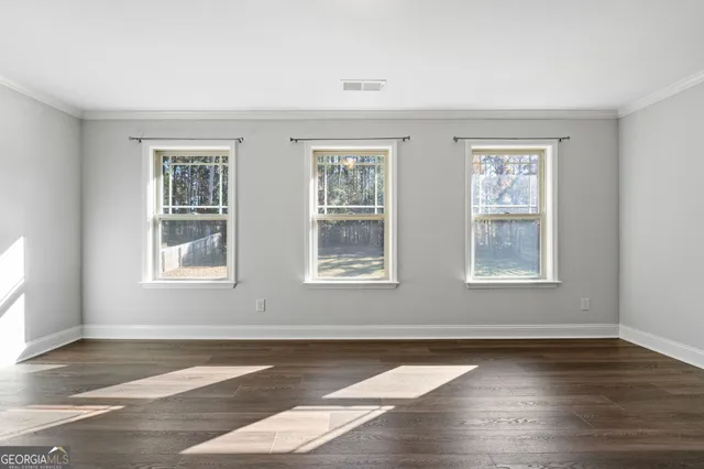 a bathroom with a granite countertop sink a mirror and shower