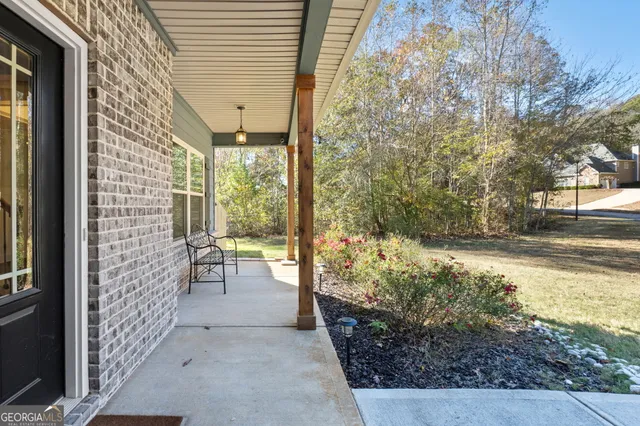 a view of an entryway with wooden floor