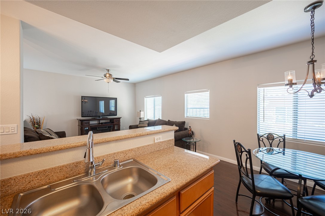 7701 West Robindale Road, Unit 274 Las Vegas, NV 89113 - Photo 17 of 38 This inviting space combines a functional kitchen with a cozy living area and a bright dining spot.