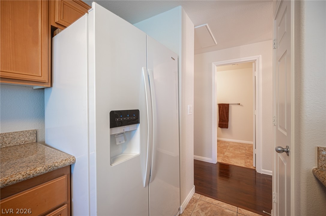 7701 West Robindale Road, Unit 274 Las Vegas, NV 89113 - Photo 19 of 38 This functional kitchen features ample cabinet space and granite counters, perfect for culinary endeavors.