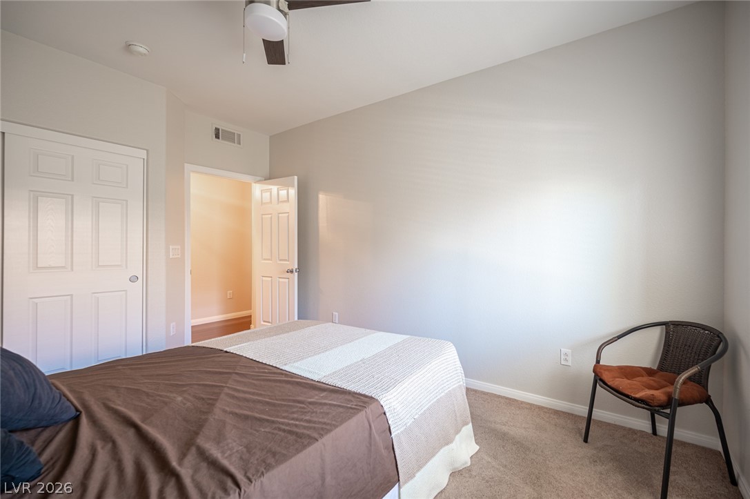 7701 West Robindale Road, Unit 274 Las Vegas, NV 89113 - Photo 27 of 38 This cozy bedroom features carpeted floors, a ceiling fan, and ample natural light.