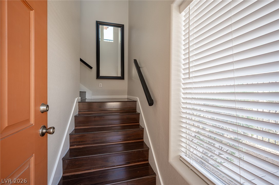 7701 West Robindale Road, Unit 274 Las Vegas, NV 89113 - Photo 3 of 38 This entry showcases a grand staircase, creating an immediate focal point.