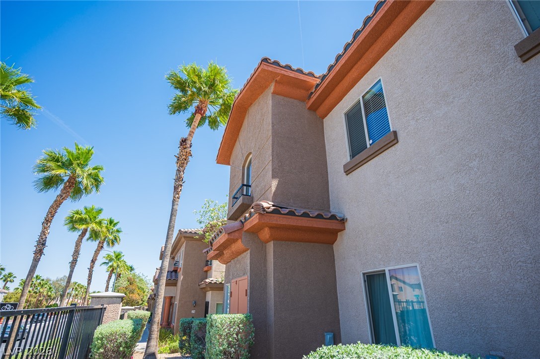 7701 West Robindale Road, Unit 274 Las Vegas, NV 89113 - Photo 36 of 38 This charming residence features appealing architecture with a stucco exterior and tiled roofing.