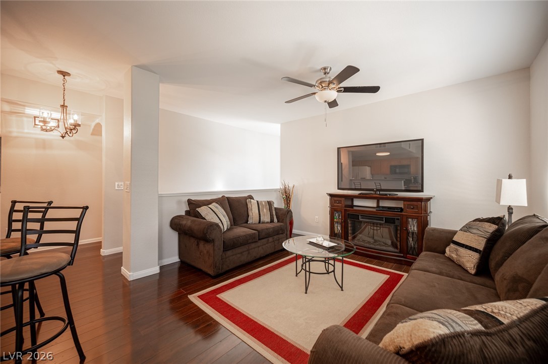 7701 West Robindale Road, Unit 274 Las Vegas, NV 89113 - Photo 6 of 38 This inviting living space features gleaming hardwood floors and a cozy atmosphere perfect for relaxation.