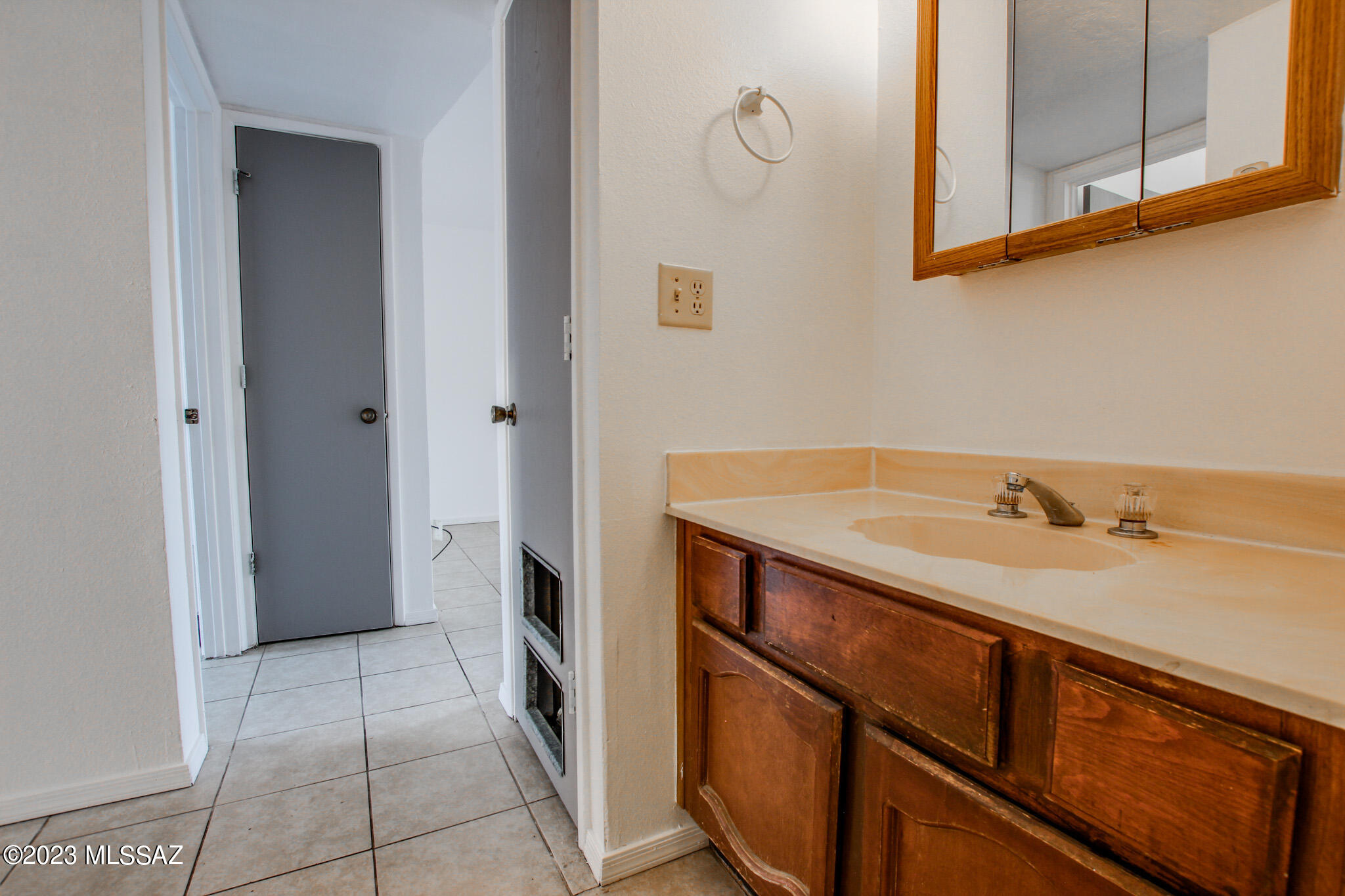 1063 East Halcyon Road Tucson, AZ 85719 - Photo 14 of 35 a bathroom with a sink and a mirror