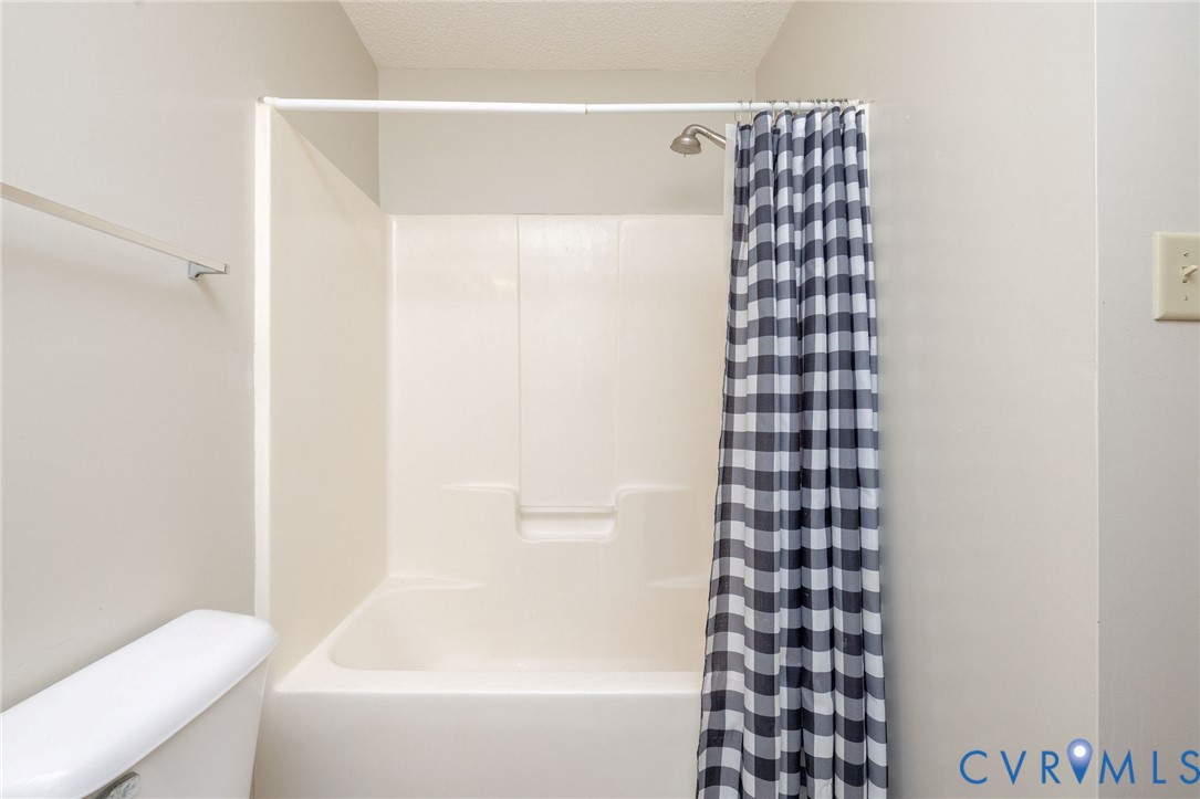 460 Horseshoe Road Jarratt, VA 23867 - Photo 19 of 24 a bathroom with a bathtub and shower