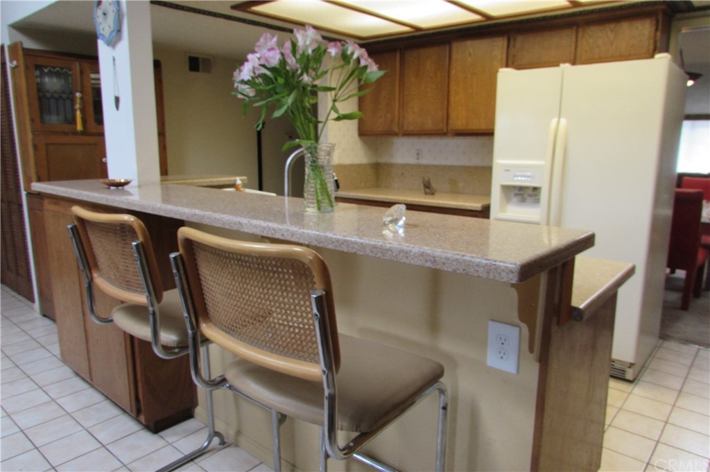 4413 Via Majorca Cypress, CA 90630 - Photo 11 of 46 a kitchen with a refrigerator sink and cabinets