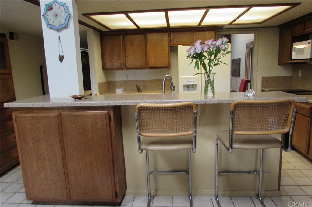 4413 Via Majorca Cypress, CA 90630 - Photo 12 of 46 a kitchen with a table and chairs in it