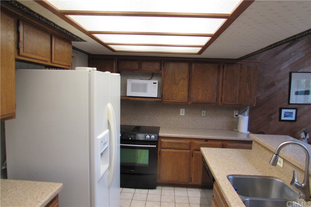 4413 Via Majorca Cypress, CA 90630 - Photo 15 of 46 a kitchen with a refrigerator and a sink
