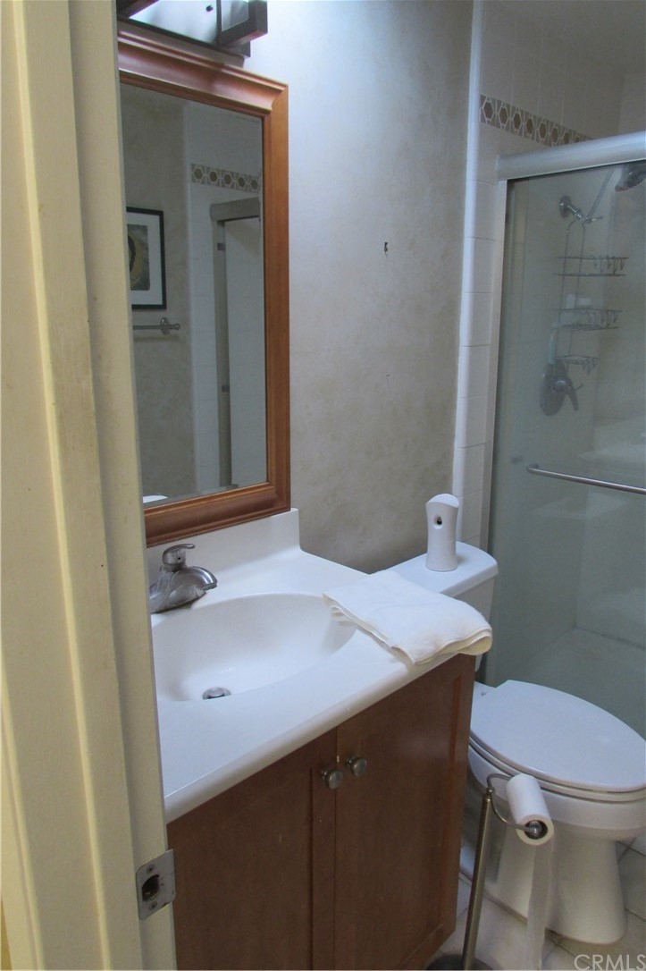 4413 Via Majorca Cypress, CA 90630 - Photo 26 of 46 a bathroom with a sink a toilet and shower
