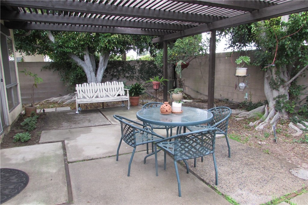 4413 Via Majorca Cypress, CA 90630 - Photo 43 of 46 a view of a patio with a table and chairs under an umbrella