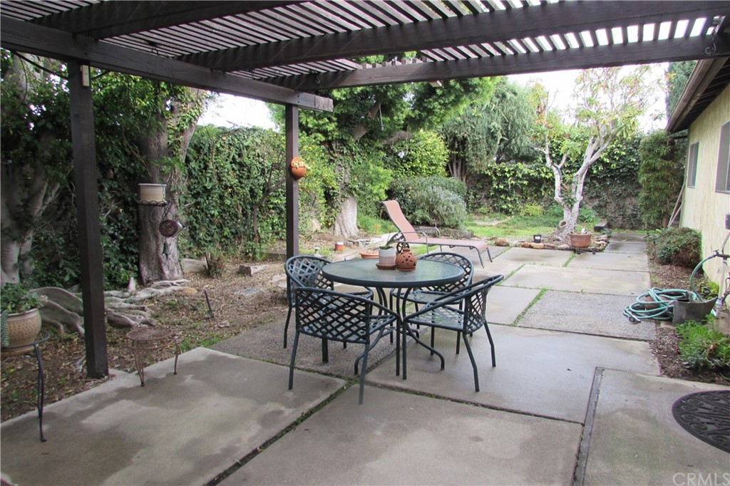 4413 Via Majorca Cypress, CA 90630 - Photo 45 of 46 a view of a patio with a table chairs and a backyard